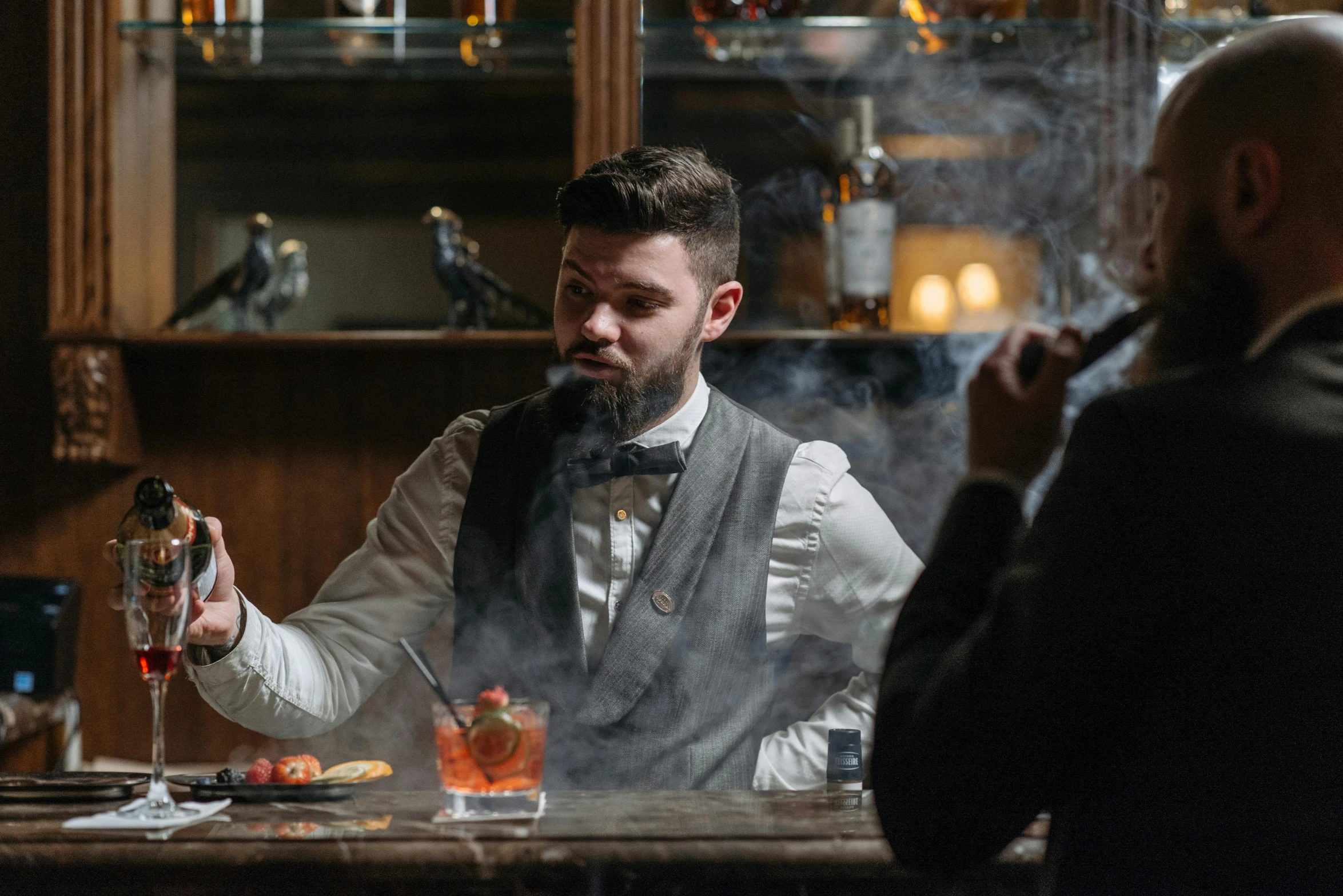 a man sitting at a bar smoking a cigarette, pexels contest winner, renaissance, smokey cannons, aussie baristas, old fashioned, medium shot of two characters