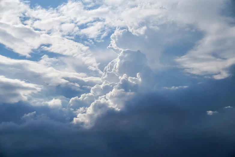 a plane flying through a cloudy blue sky, by Jan Rustem, unsplash, romanticism, hyperdetailed storm clouds, ceremonial clouds, silver lining, multiple stories