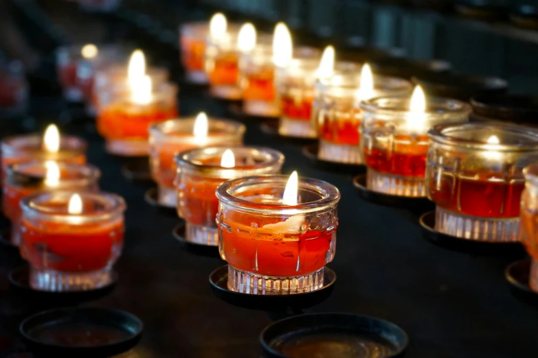 a group of candles sitting on top of a table, profile image