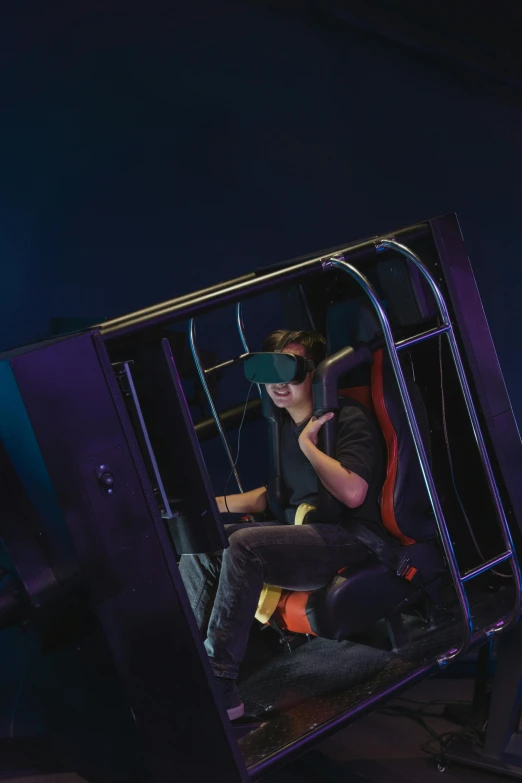 a man sitting in a chair in front of a tv, a hologram, interactive art, into glory ride, wearing vr goggles, flying through the air, avatar image