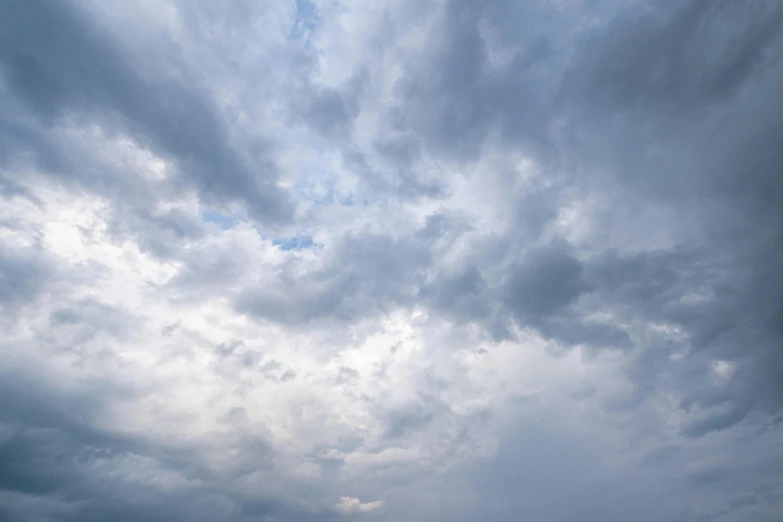 a group of people standing on top of a beach under a cloudy sky, a picture, by Jan Rustem, unsplash, minimalism, seen from below, thunderstorm outside, close - up photograph, today\'s featured photograph 4k