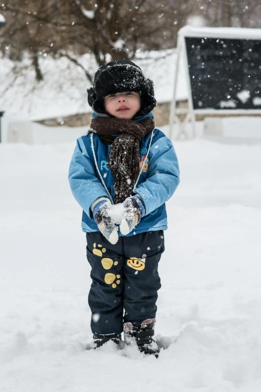 a little boy that is standing in the snow, pexels contest winner, 💣 💥💣 💥, mittens, avatar image, print ready