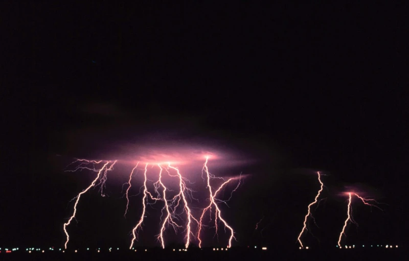 a group of lightning flashes over a city at night, a picture, shot on hasselblad, 1987 photograph, bolts, thumbnail