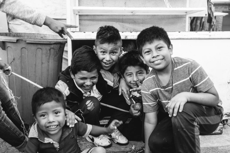 a black and white photo of a group of children, a black and white photo, by Kristian Zahrtmann, pexels, quito school, the boys, happy friend, mexico city, 15081959 21121991 01012000 4k