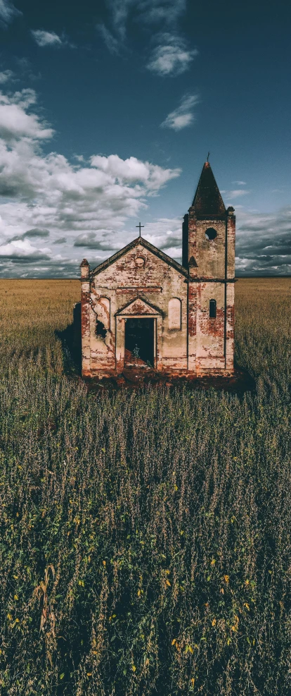 an old church in the middle of a field, an album cover, by Attila Meszlenyi, pexels contest winner, renaissance, rural wastelands, 15081959 21121991 01012000 4k, kris kuksi, brazil