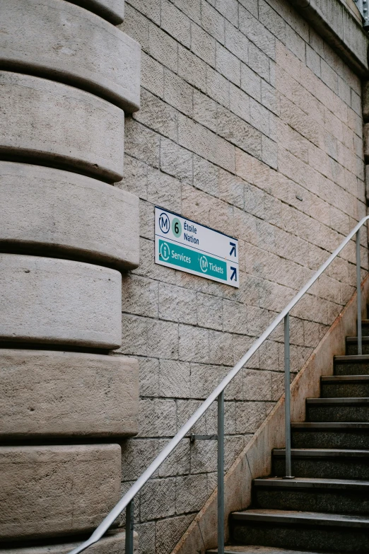 a man riding a skateboard down a flight of stairs, a poster, by Ian Hamilton Finlay, unsplash, graffiti, limestone, traffic signs, street of teal stone, french architecture
