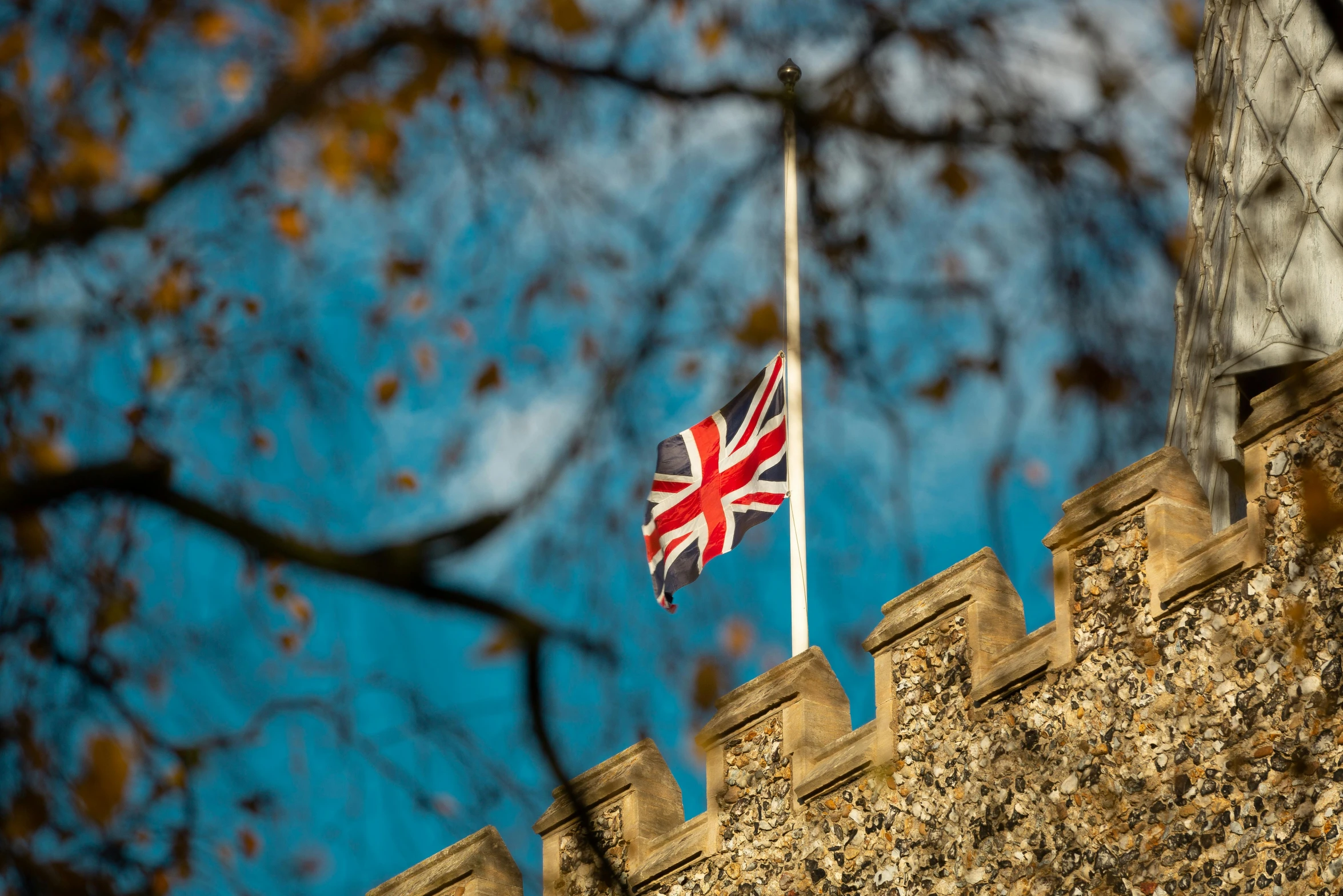 a british flag flying on top of a building