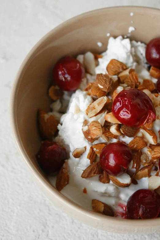 a bowl of yogurt topped with cherries and nuts, renaissance, rice, detailed product image, lifestyle, small