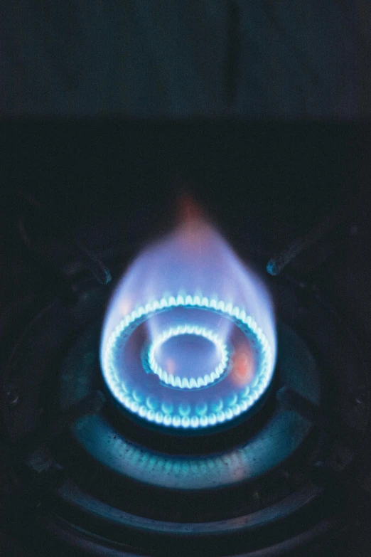 a gas stove with a blue flame coming out of it, spiraling, multiple lights, best practice, square