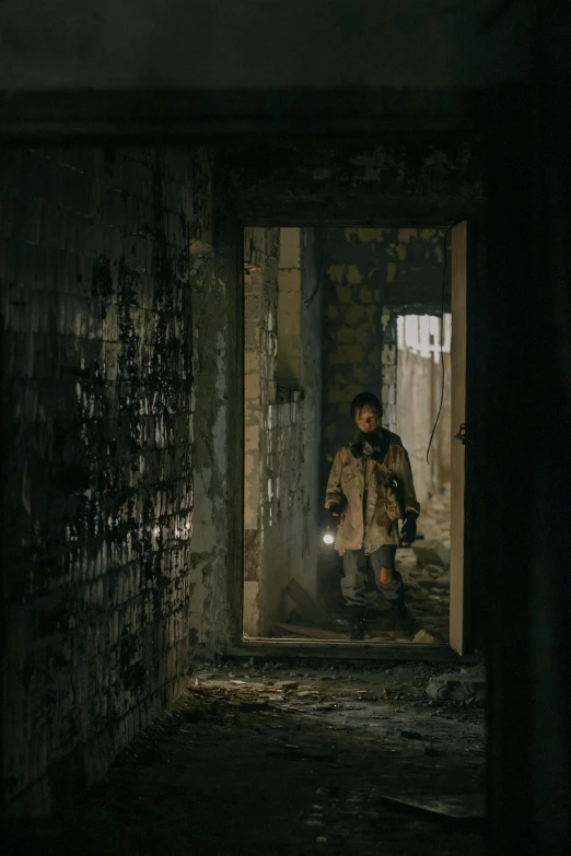 a person standing in a room with graffiti on the walls, inspired by roger deakins, entrance to abandoned mine, cinematic lut, wearing ripped dirty flight suit, neo norilsk