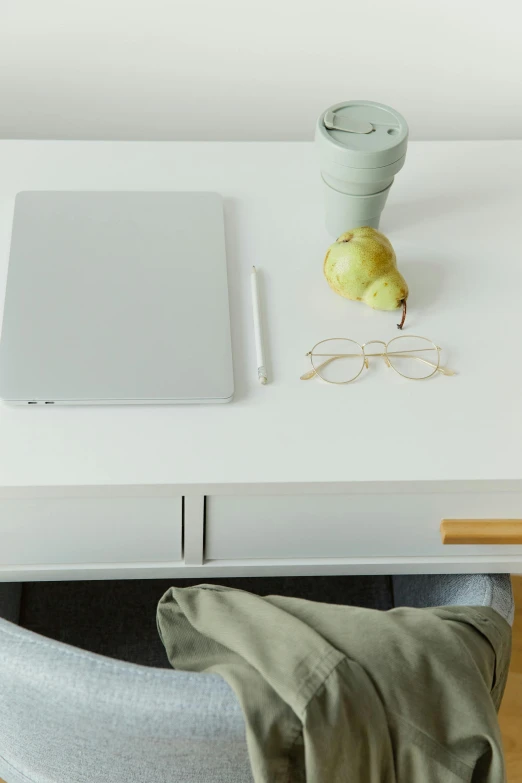 a laptop computer sitting on top of a white desk, pear, designed for cozy aesthetics!, zoomed in, product image