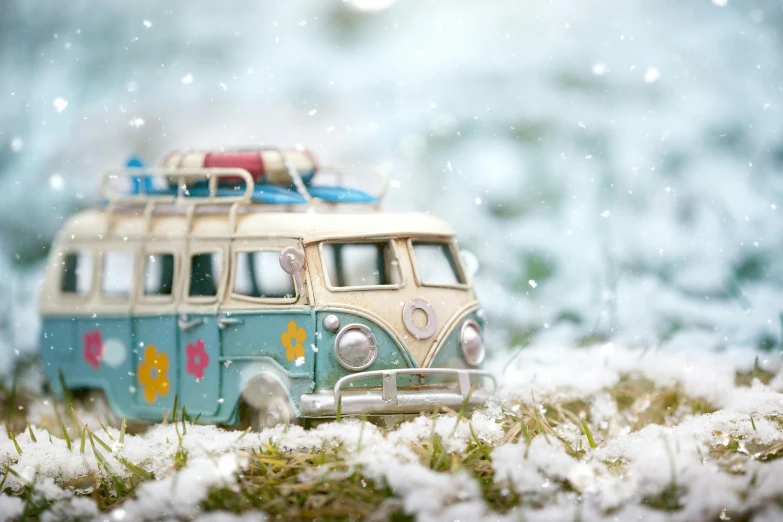 a toy van sitting on top of snow covered ground, by Elaine Hamilton, unsplash contest winner, flower power, microbus, avatar image, holiday