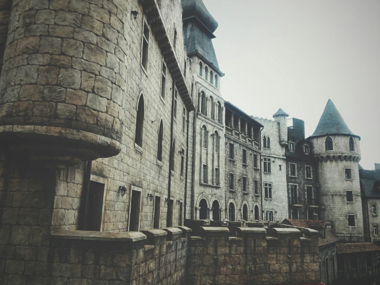 a castle like building with a clock tower, pexels contest winner, realistic cinematic style, brutalist courtyard, turrets, gray