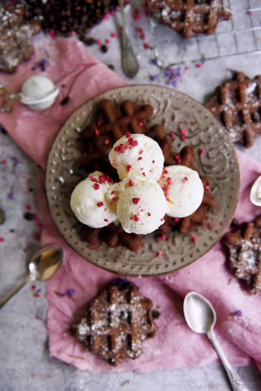 a plate of cookies with white frosting and sprinkles, inspired by Henriette Grindat, unsplash, renaissance, ice cream cones, deconstructed waffle, raspberry, brunette