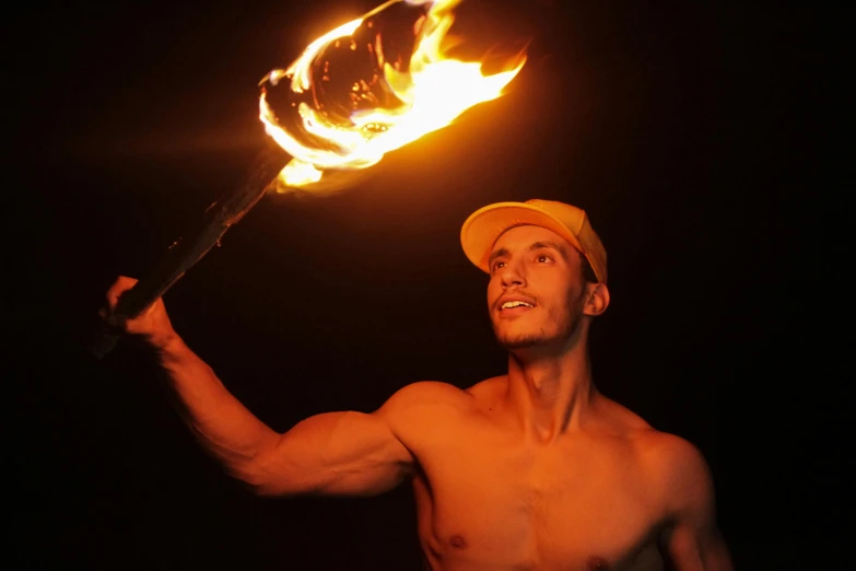 a man with a fire stick in his hand, pexels contest winner, renaissance, zyzz, torch lighting, manly, lit from bottom