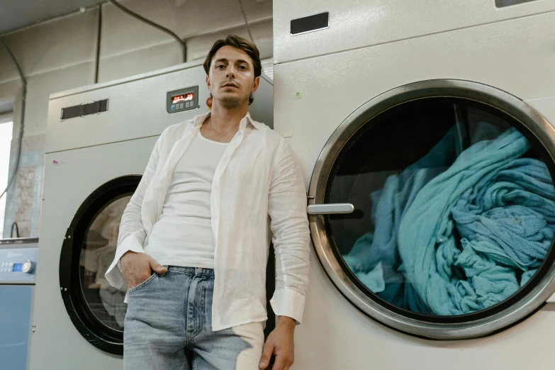 a man standing in front of a washing machine, pexels contest winner, wearing a white button up shirt, guido reni style, lachlan bailey, 15081959 21121991 01012000 4k