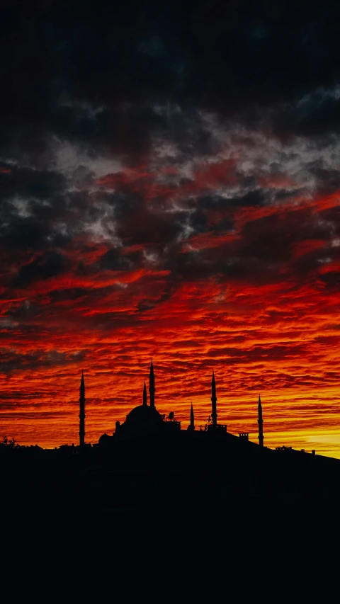 the sky is red and orange as the sun sets, an album cover, pexels contest winner, hurufiyya, istanbul, 2 5 6 x 2 5 6, ceremonial clouds, getty images