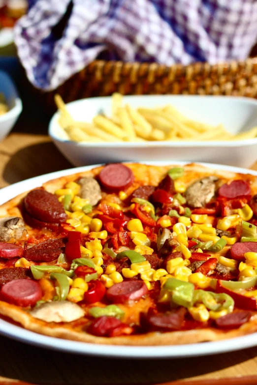 a pizza sitting on top of a white plate, corn, bowl filled with food, vibrant colour, hotdogs