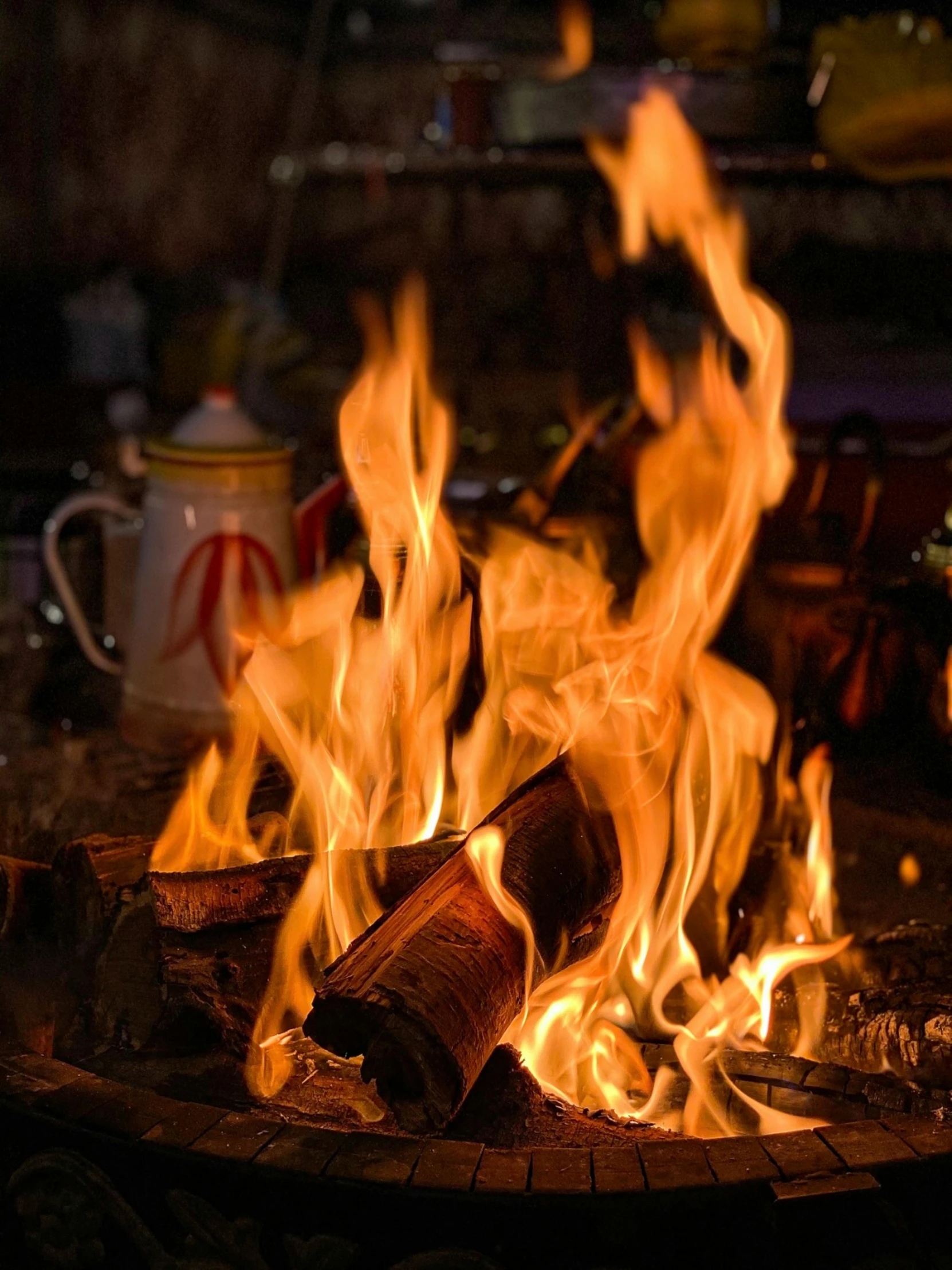 a close up of a fire on a grill, by Daniel Lieske, pexels contest winner, renaissance, cozy cafe background, avatar image, multiple stories, high detailed photo