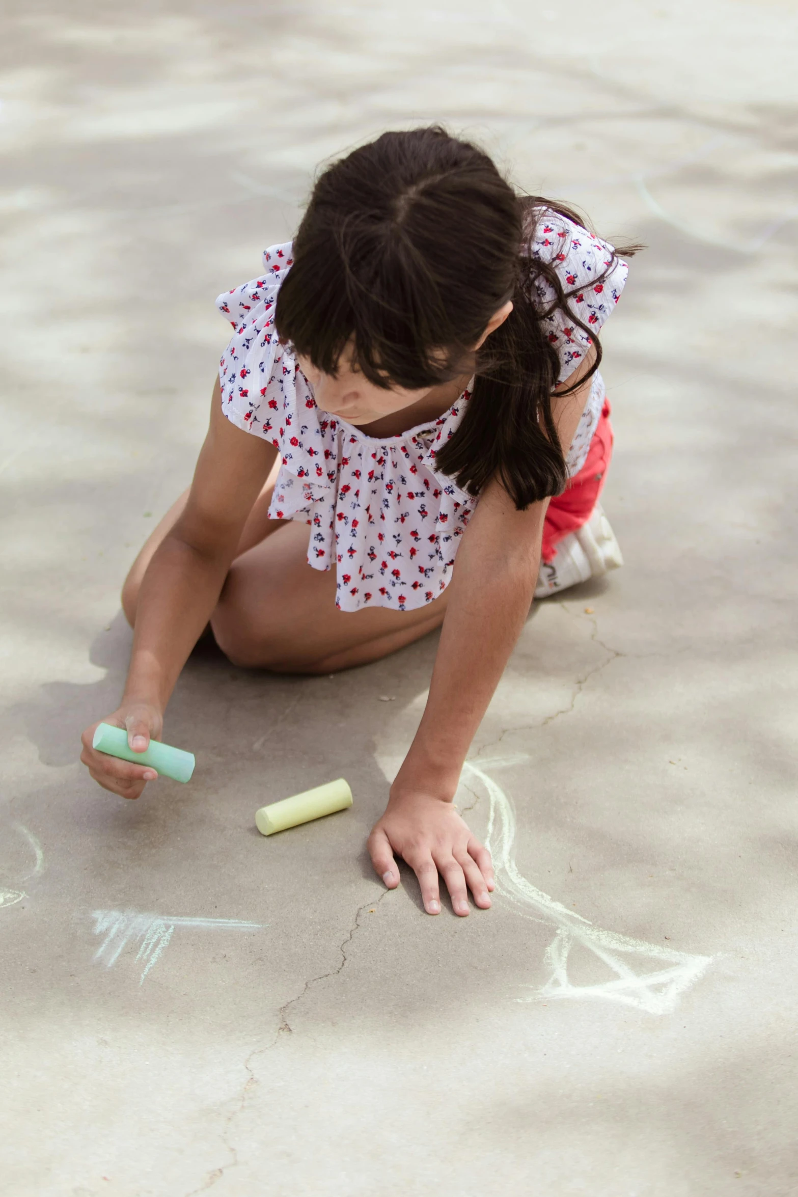 a little girl sitting on the ground drawing with chalk, idealised, soft shade, a super-smart, soft cracks