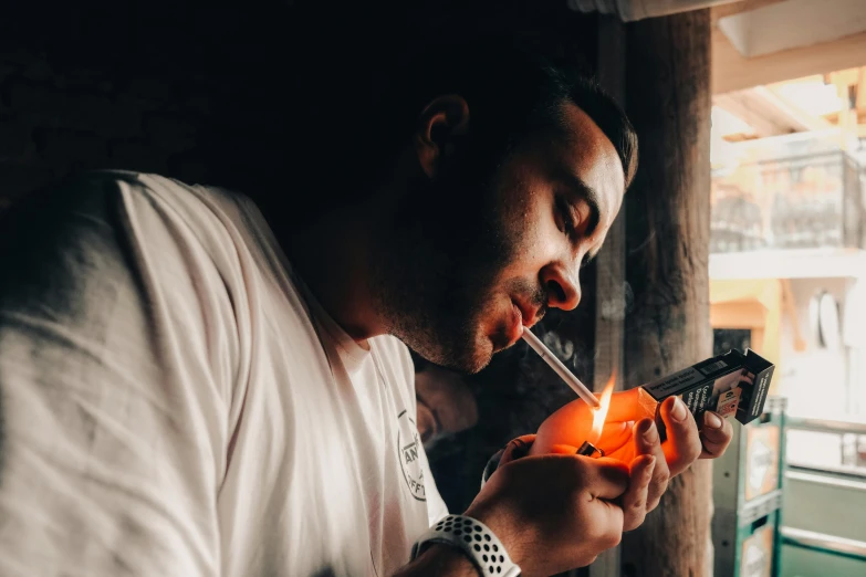 a man smoking a cigarette while holding a cell phone, pexels contest winner, hyperrealism, wearing an orange t shirt, smoking a magical bong, profile image, smoking a bowl of hash together