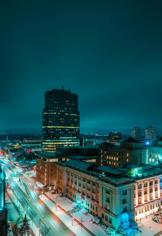 an aerial view of a city at night, by Andrew Domachowski, square, teal sky, 4k photo”