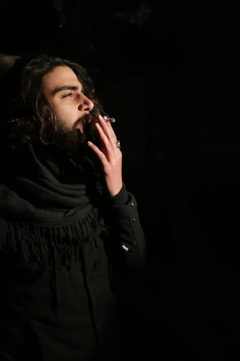 a man smoking a cigarette in the dark, an album cover, pexels contest winner, middle eastern skin, hairy, ( ( theatrical ) ), pose 4 of 1 6