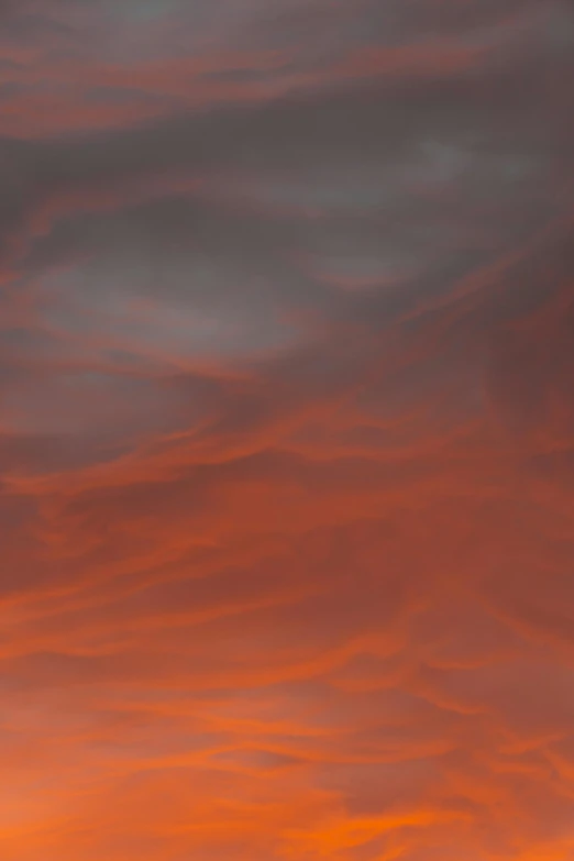 a plane flying in the sky at sunset, a picture, inspired by Frederic Church, red swirls, soft red texture, grey orange, daniel richter