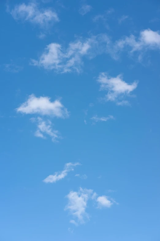 a person is flying a kite high in the sky, by Andries Stock, minimalism, peaceful puffy clouds, # nofilter, 15081959 21121991 01012000 4k, cumulus cloud tattoos