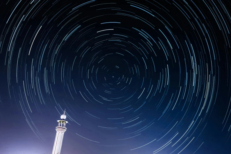 a lighthouse at night with a star trail in the sky, a microscopic photo, unsplash contest winner, hurufiyya, futuristic marrakech, auckland sky tower, night starry sky full of cats, orbital rings