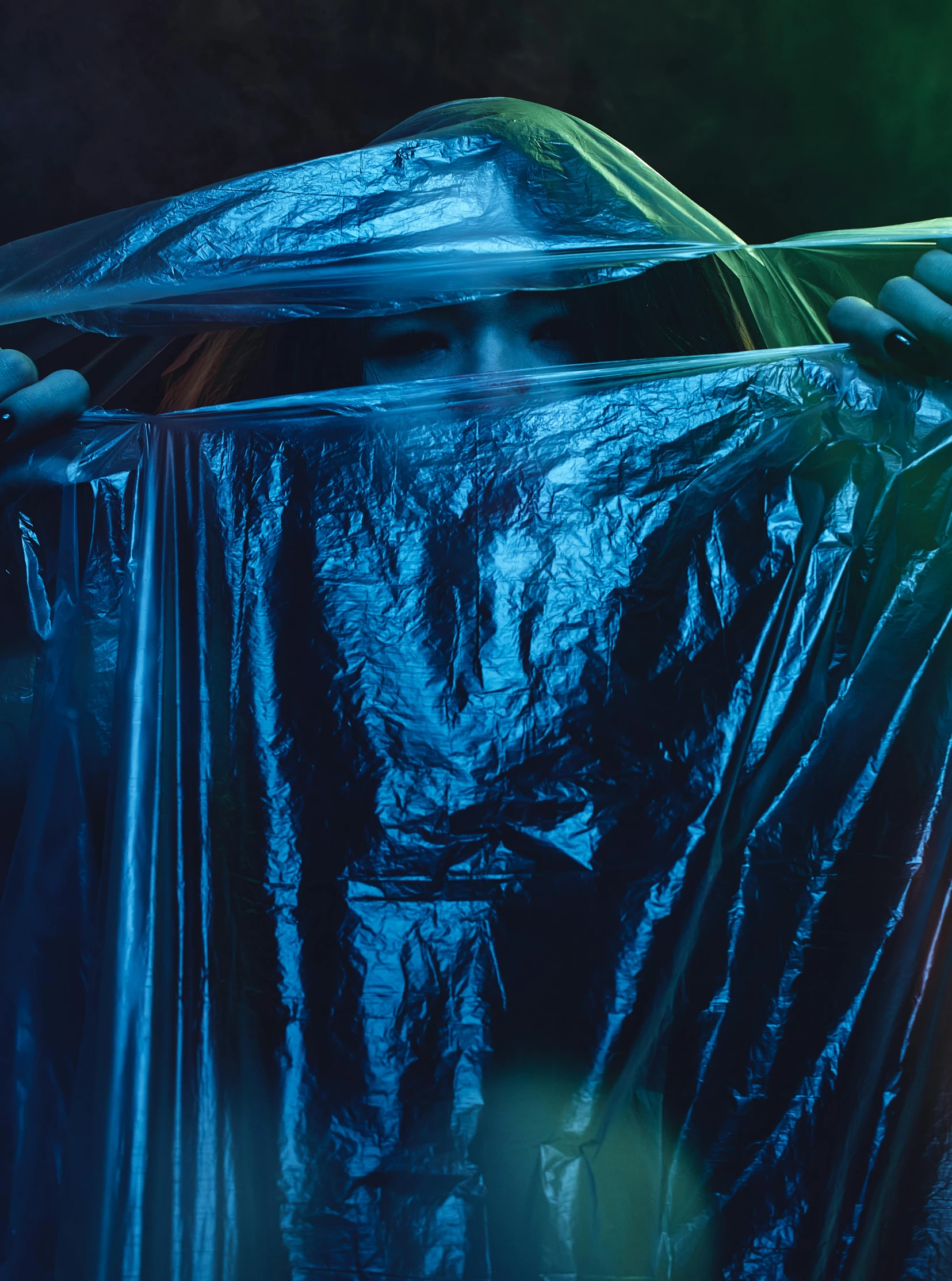 a close up of a trash can covered in plastic, an album cover, inspired by Elsa Bleda, unsplash contest winner, plasticien, long blue cape, translucent neon skin, wet drapery, metallic torso