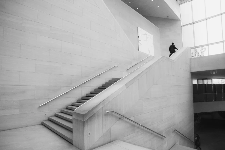 a man riding a skateboard up the side of a flight of stairs, a black and white photo, unsplash contest winner, minimalism, smithsonian american art museum, white marble interior photograph, john pawson, by joseph binder