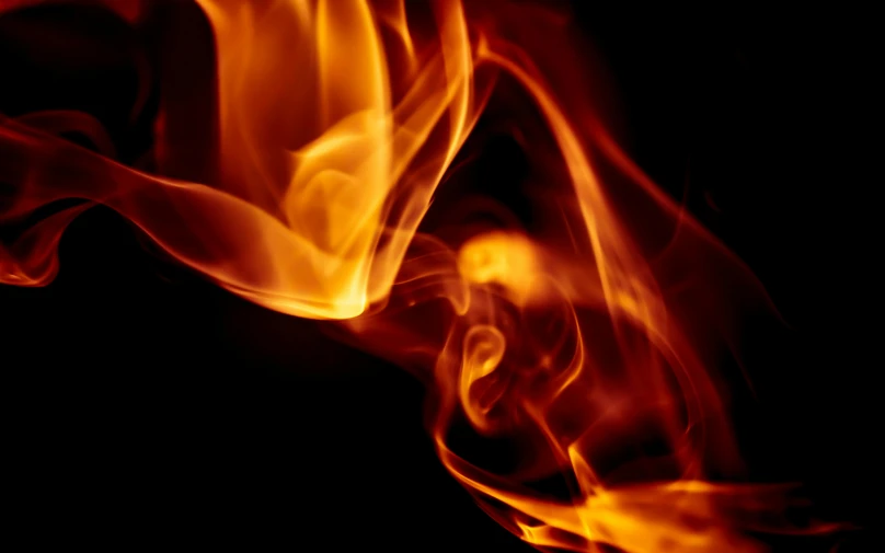 a close up of a fire on a black background, pexels, avatar image, flare, slow shutter, profile image