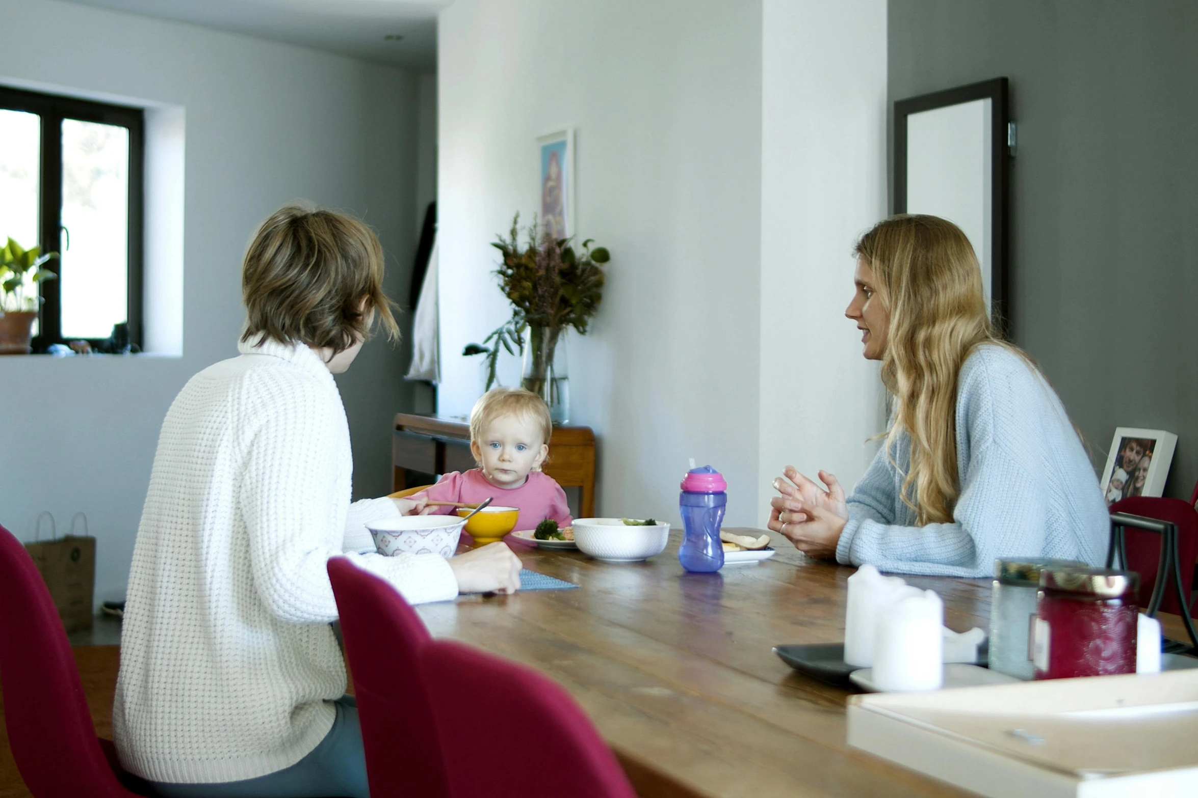 a couple of people that are sitting at a table, maternal, open plan, profile image, rectangle