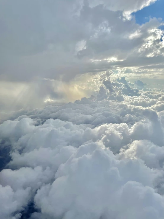 a view of the sky and clouds from an airplane, by Daniel Taylor, pexels contest winner, surrealism, hyperdetailed storm clouds, bird\'s eye view, taken on iphone 1 3 pro, smiling in heaven