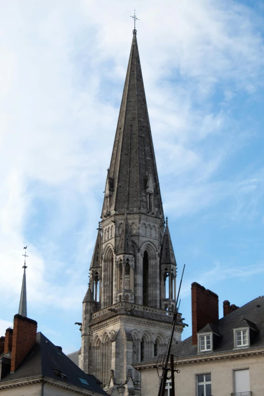 a tall building with a steeple on top of it, inspired by Pierre Toutain-Dorbec, romanesque, hull, buildings carved out of stone, trinity, chesterfield