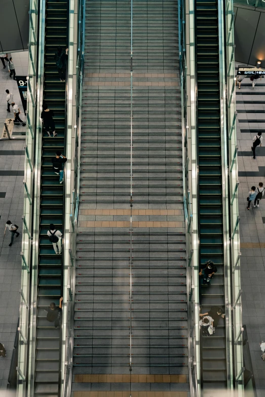 a group of people walking up and down an escalator, an album cover, inspired by Andreas Gursky, pexels contest winner, japanese downtown, 16k resolution:0.6|people, outdoor staircase, view from slightly above