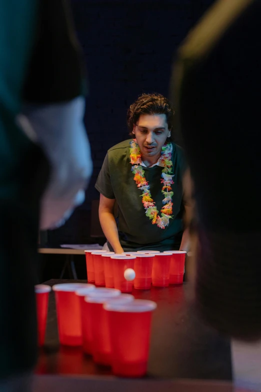 a group of people playing a game of beer pong, an album cover, by John Luke, pexels contest winner, ( ( theatrical ) ), at college, bartending, julian ope