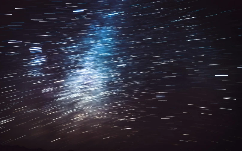 a night sky filled with lots of stars, a microscopic photo, by Daniel Lieske, pexels, light and space, streaks, interstellar hyper realism, slightly pixelated, speed blur