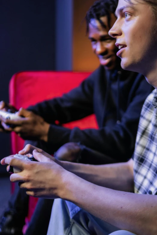 a group of young men playing a video game, pexels, focus on two androids, at netflix, california;, diverse