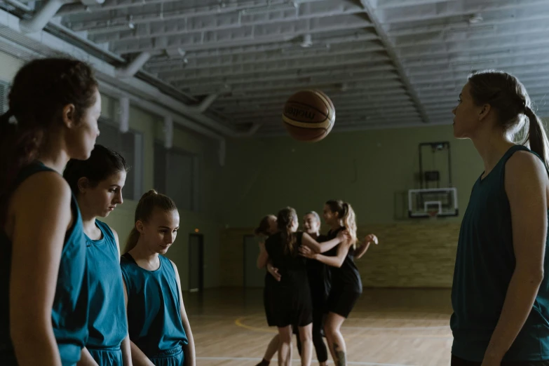 a group of young women playing a game of basketball, by Emma Andijewska, dribble, danube school, long cinematic shot, local gym, 15081959 21121991 01012000 4k, portrait of tall