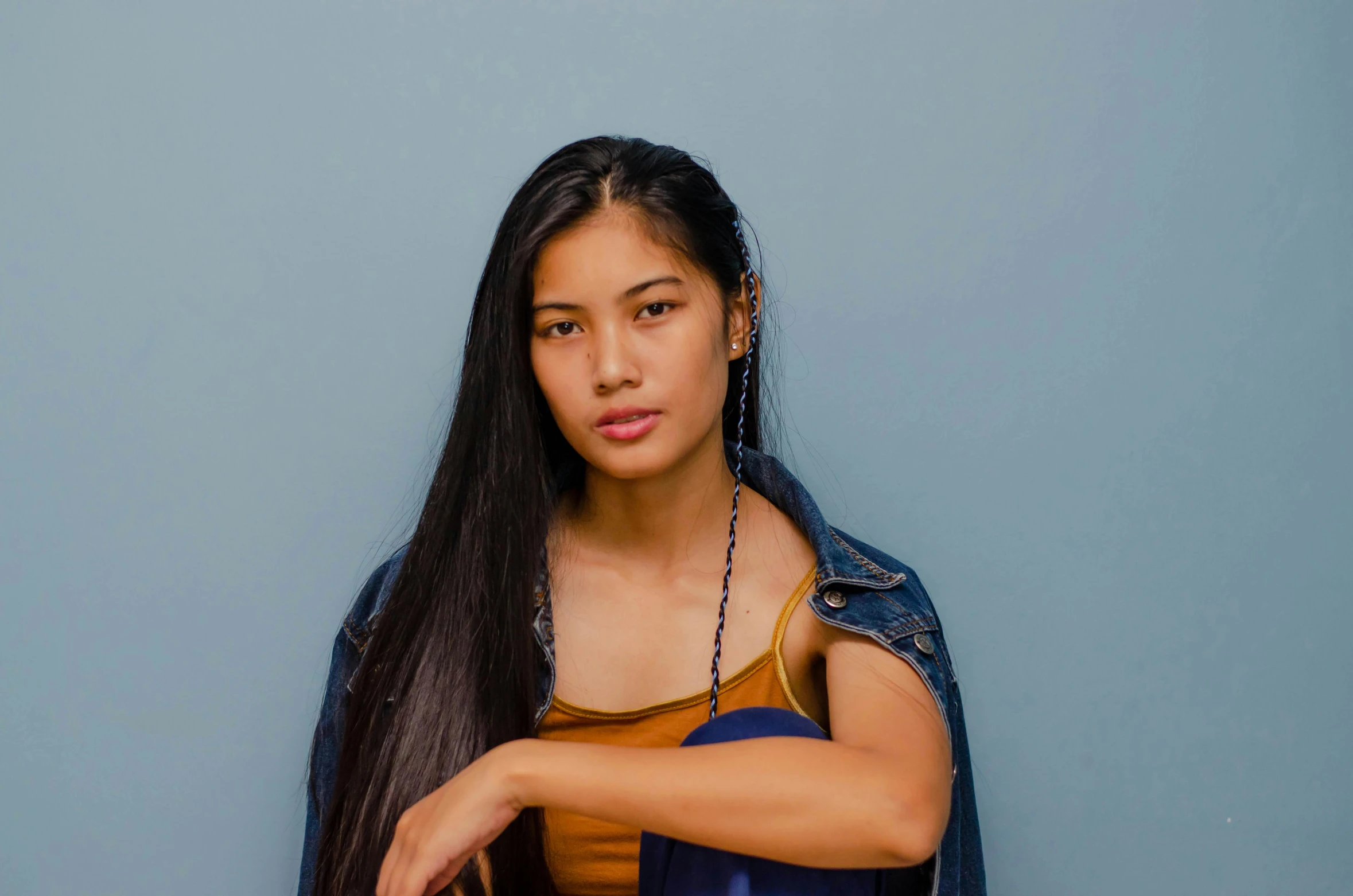 a woman with long black hair posing for a picture, inspired by Ruth Jên, pexels contest winner, girl in studio, 18 years old, promotional image, profile image