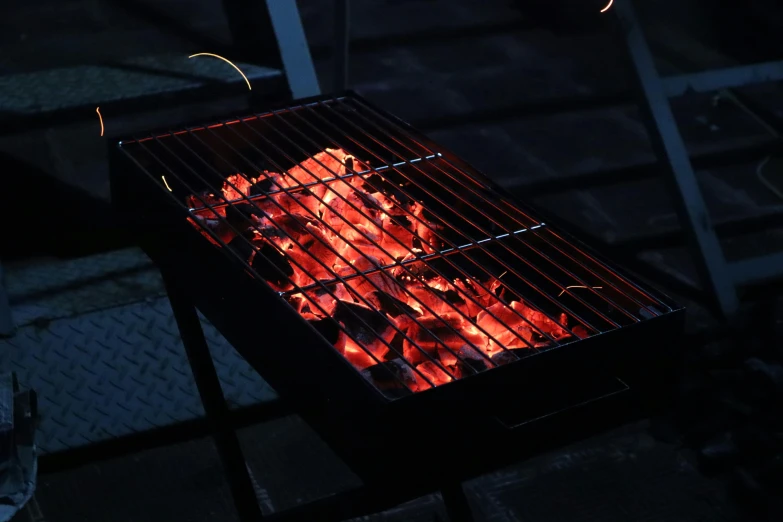 a close up of a grill with flames on it, pexels contest winner, hurufiyya, red and obsidian neon, rectangular, eating outside, light dark