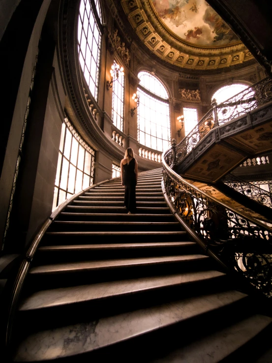 a man standing on top of a set of stairs, inspired by Elsa Bleda, pexels contest winner, baroque, inside a grand, female ascending, gigapixel maximum upscale, mexico city