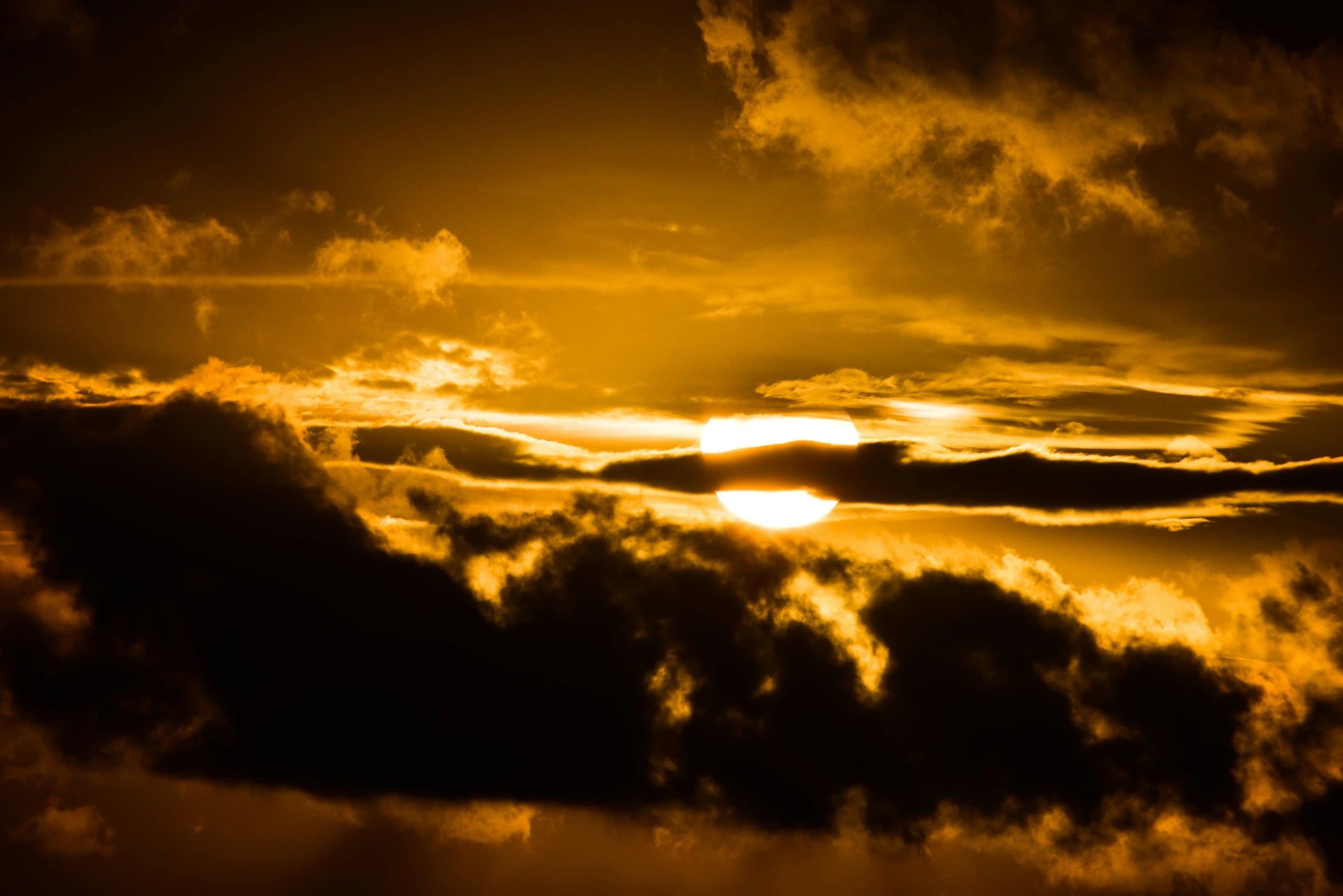 the sun is setting behind the clouds in the sky, an album cover, by Jan Tengnagel, pexels, romanticism, gold, dark orange night sky, yellow, infinite