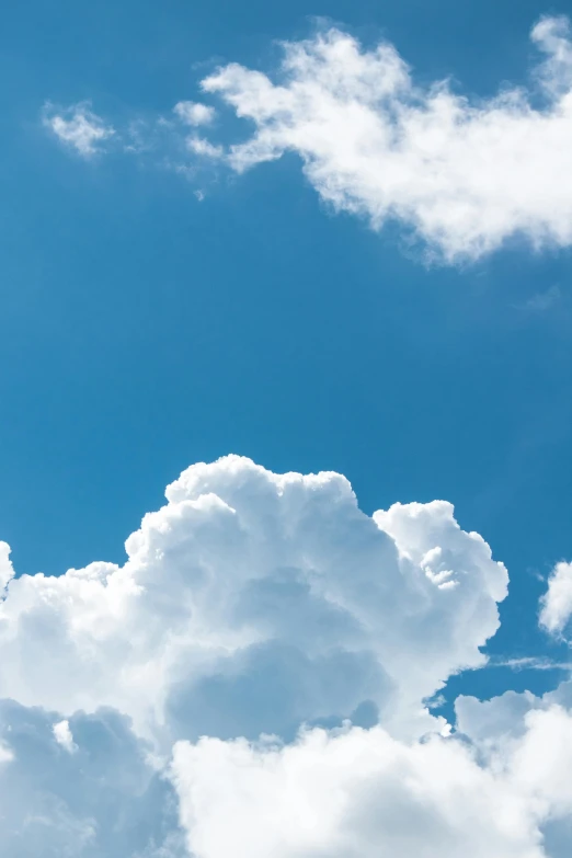 a plane flying through a cloudy blue sky, by Jan Rustem, unsplash, minimalism, giant cumulonimbus cloud, profile image