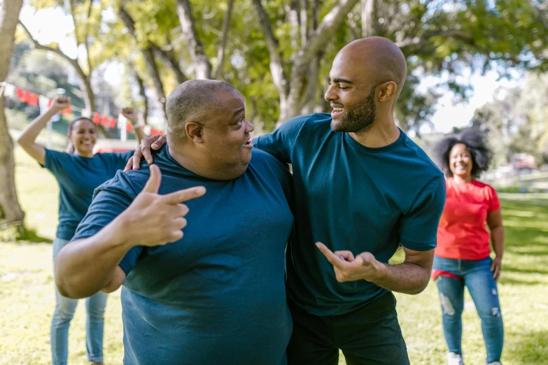 a couple of men standing next to each other in a park, pexels contest winner, happening, an overweight, dancing with each other, sydney park, avatar image