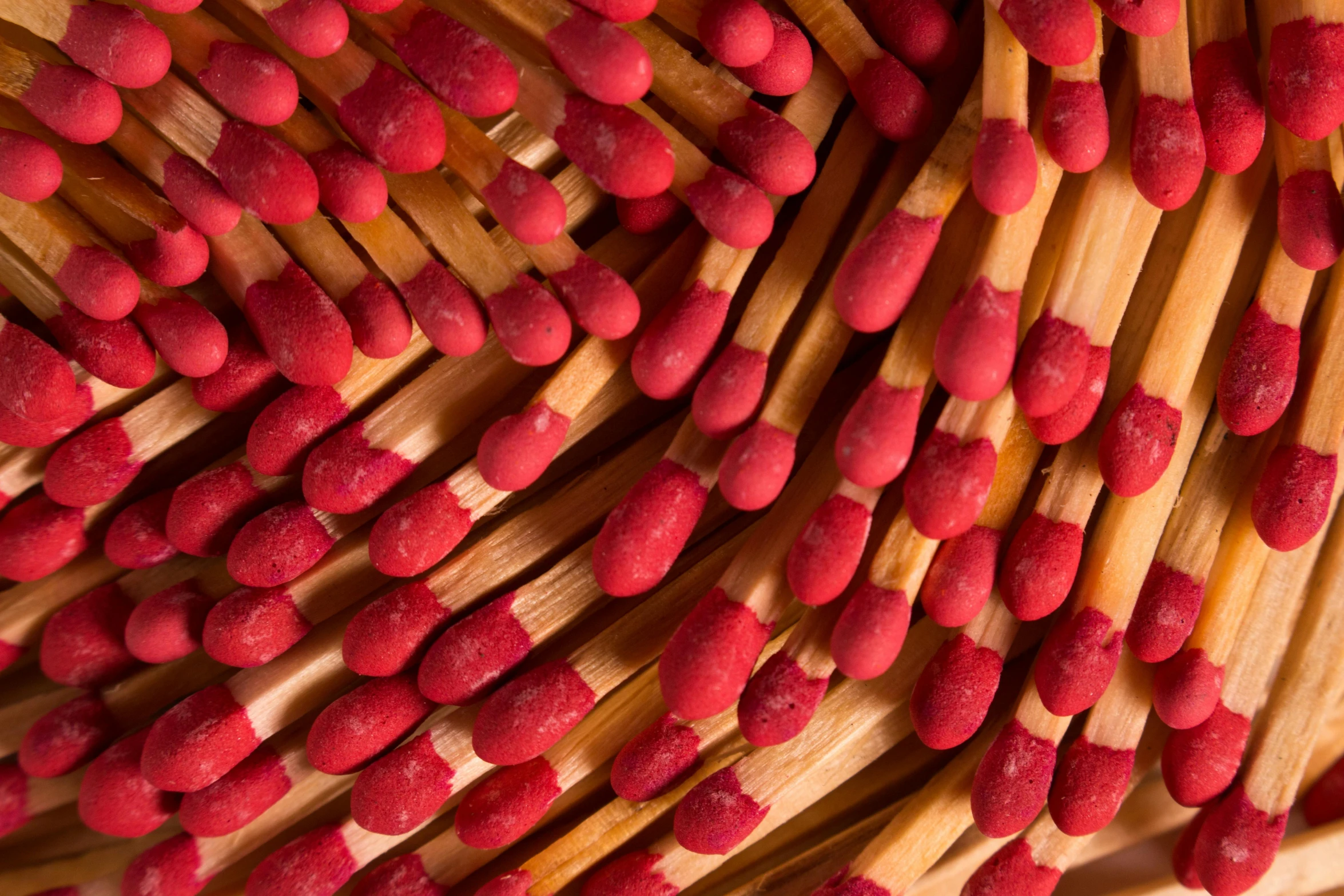 a pile of matches sitting on top of each other, a macro photograph, by Matija Jama, pexels, process art, shades of red, bamboo, closeup headshot, fan favorite