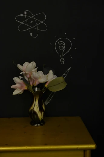 a vase filled with flowers sitting on top of a wooden table, inspired by Robert Mapplethorpe, unsplash contest winner, surrealism, blackboard, edison bulb, magnolias, gold