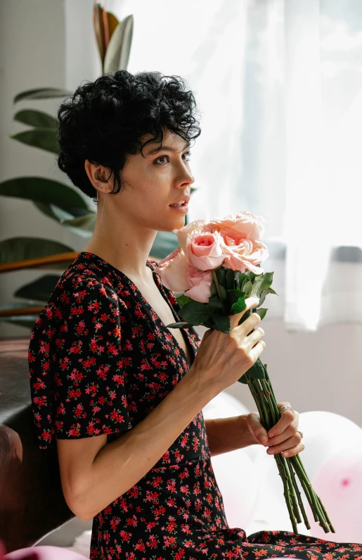 a woman sitting in a chair holding a bunch of flowers, pexels, renaissance, short black pixie cut hair, growing out of a giant rose, rebecca sugar, indoor picture